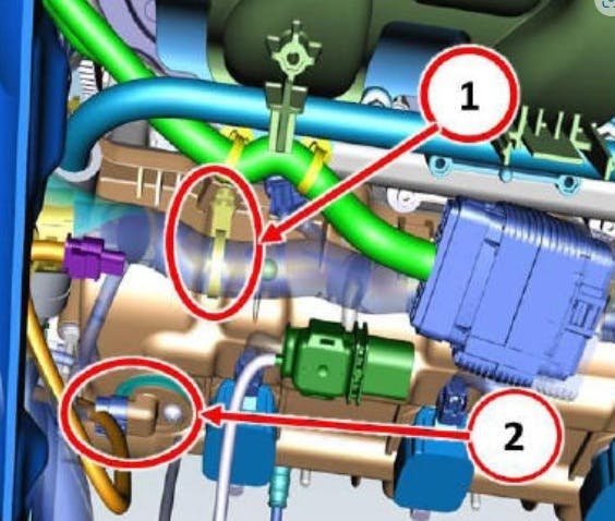 1) engine harness tower clip. 2) camshaft position sensor (CMP)